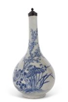 A Chinese porcelain vase of pear shape decorated in underglaze blue with plants and foliage, Chinese
