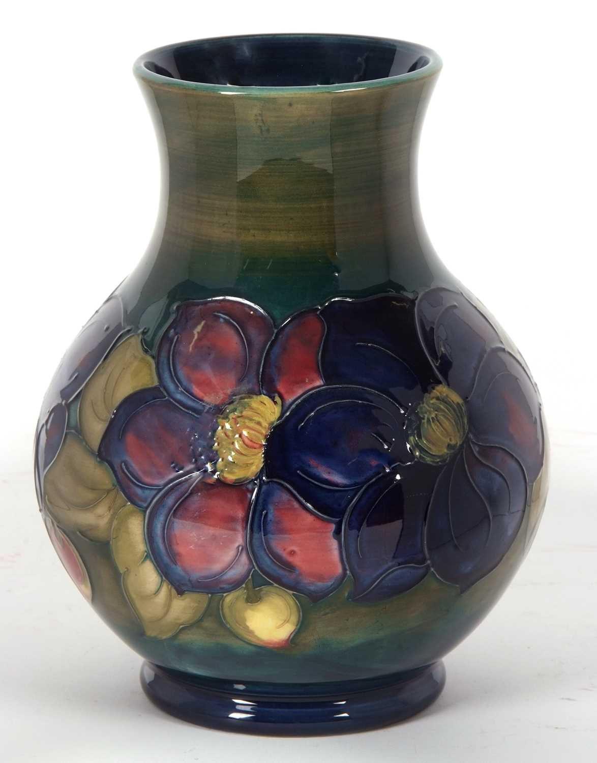 A Moorcroft vase, the baluster body with tubelined decoration with the anemone pattern on a green - Image 2 of 4