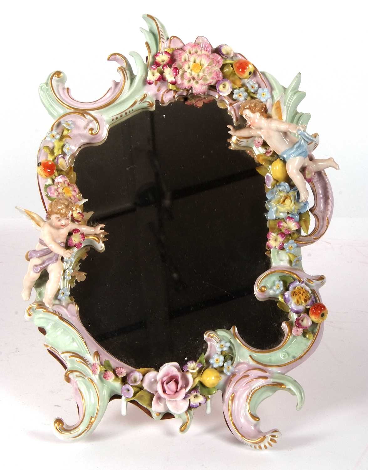 A continental porcelain mirror the porcelain frame with Rococo decoration with applied flowers and - Image 2 of 3