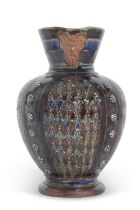 Early Doulton Lambeth stone ware jug, the bulbous body with a blue and green design, the spout