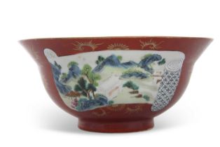 A coral ground Chinese porcelain flared bowl with reserves of polychrome landscapes, Chien Lung mark