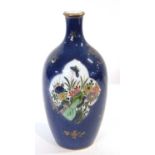 A French porcelain bottle vase in Chinese style, 19th Century, the powder blue ground with gilt