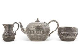 A cased Victorian three piece silver breakfast service, comprising teapot, milk jug and sugar