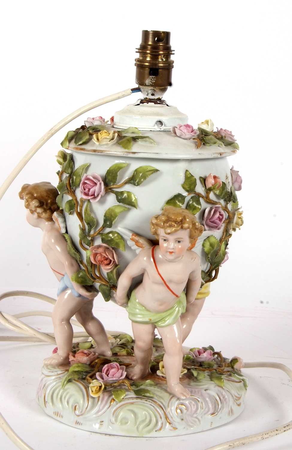 A large continental porcelain lamp base, the lamp base supported by three large cherubs with applied - Image 4 of 8