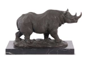 A contemporary hollow bronze model of a rhinoceros set on a polished black marble plinth base,
