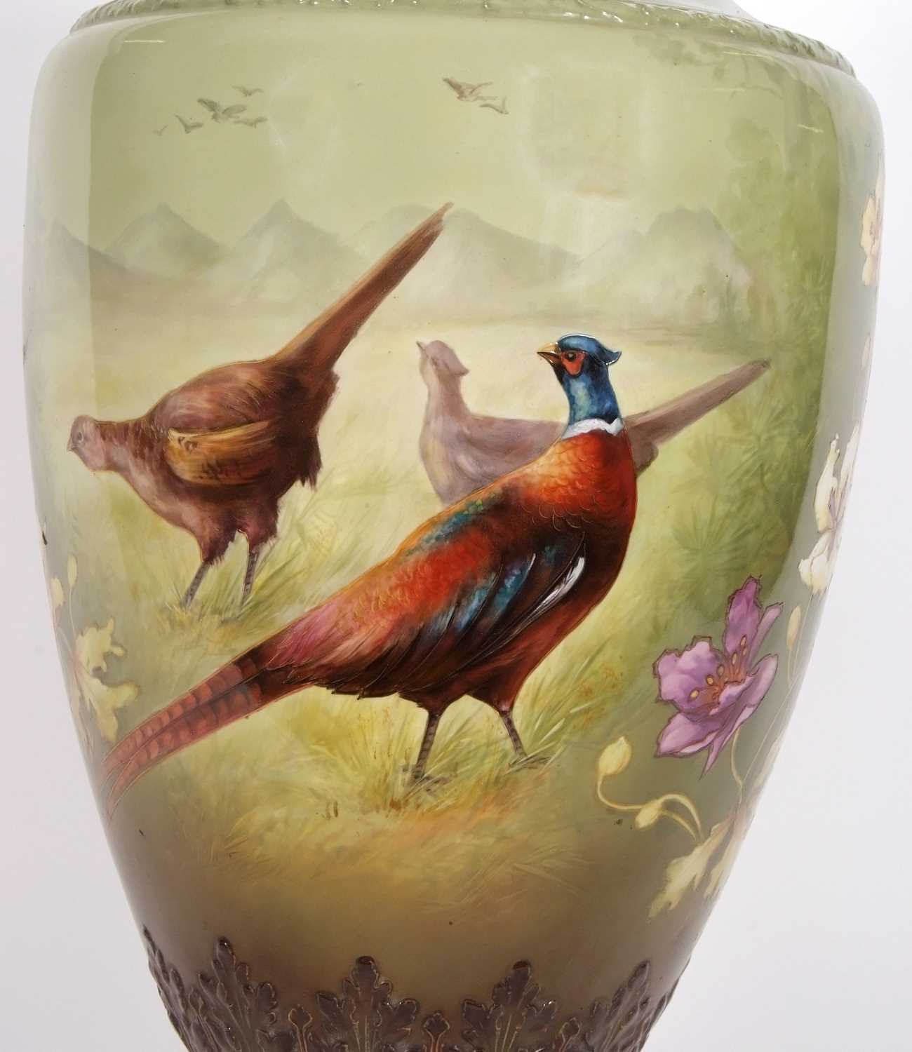 A very large Art Nouveau style vase, the green ground painted with pheasants and flowers, probably - Image 2 of 9