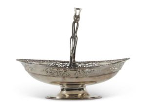 A George V silver swing handle basket of oval form having a beaded border, the body pierced with