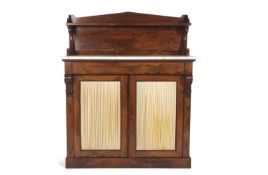 An early Victorian rosewood chiffonier with single galleried back shelf with scrolled supports