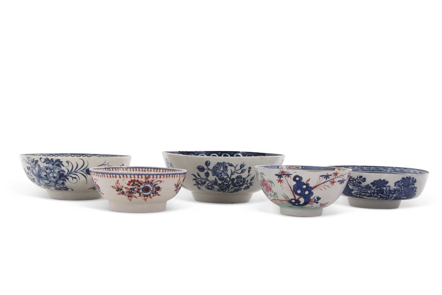 A collection of 18th Century English porcelain bowls with blue and white and polychrome designs