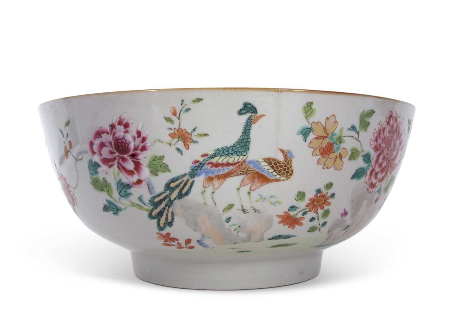 A large 18th Century Chinese porcelain famille rose punch bowl, decorated with birds amongst foliage