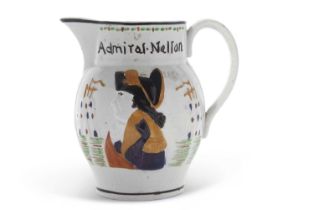 A Pratt Ware type jug modelled with Admiral Nelson in relief, the reverse with Captain Hardy, 15cm