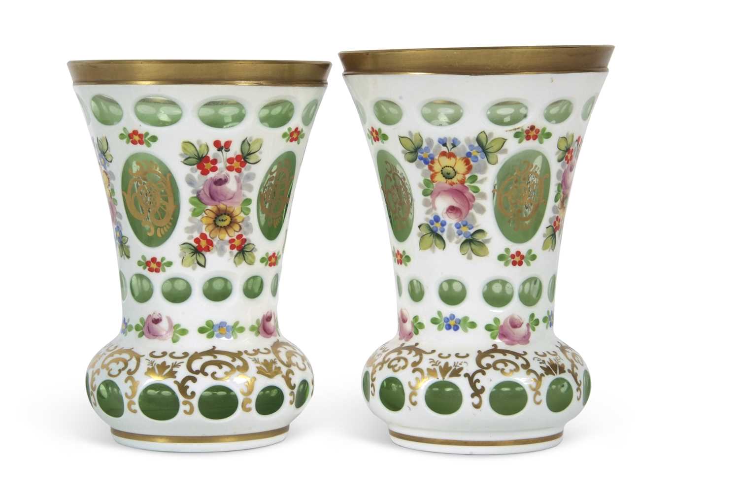 A pair of Bohemian style vases, the white flashed ground decorated with floral sprays,