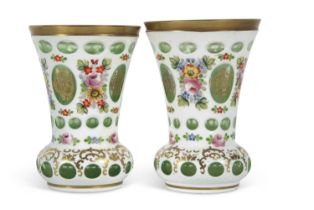 A pair of Bohemian style vases, the white flashed ground decorated with floral sprays,