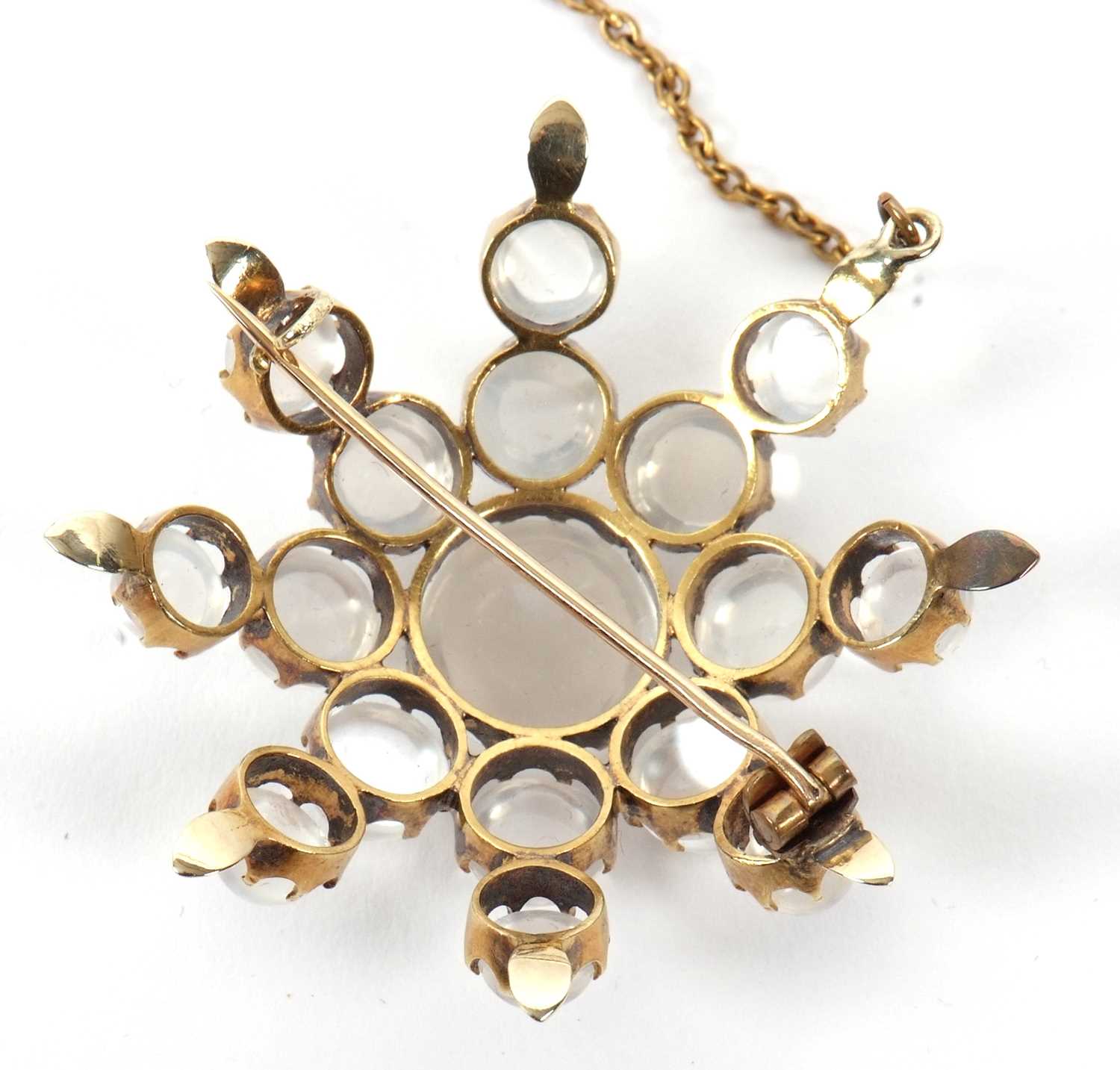 A moonstone 'star' brooch, the star shape comprised of graduated round moonstone cabochons, all claw - Image 3 of 7