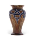 A Royal Doulton vase by Frank Pope, of baluster shape the brown ground with a blue Art Nouveau style