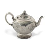 A Victorian silver teapot of globular bullet shaped onto a cast beaded circular spreading foot,