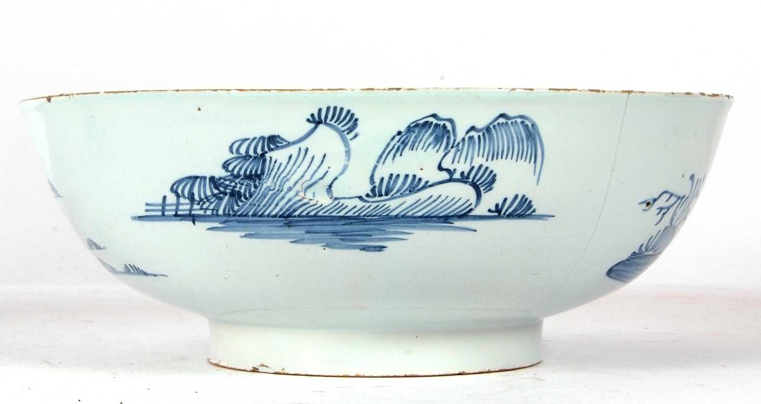 An English Delft punch bowl circa 1760 with blue and white design of house and trees in Chinese - Image 4 of 7
