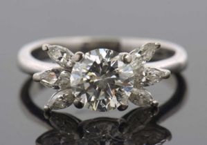 A diamond cluster ring, the central round brilliant cut diamond, estimated approx. 1.66cts, in a