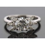 A diamond cluster ring, the central round brilliant cut diamond, estimated approx. 1.66cts, in a