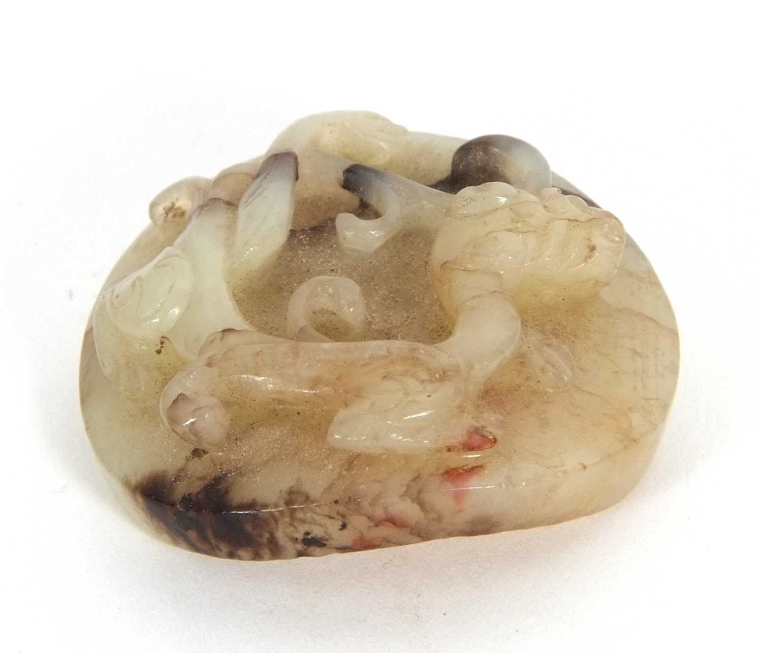 A jade pendant with dragon carving with brown occlusions, 4cm diameter - Image 3 of 6