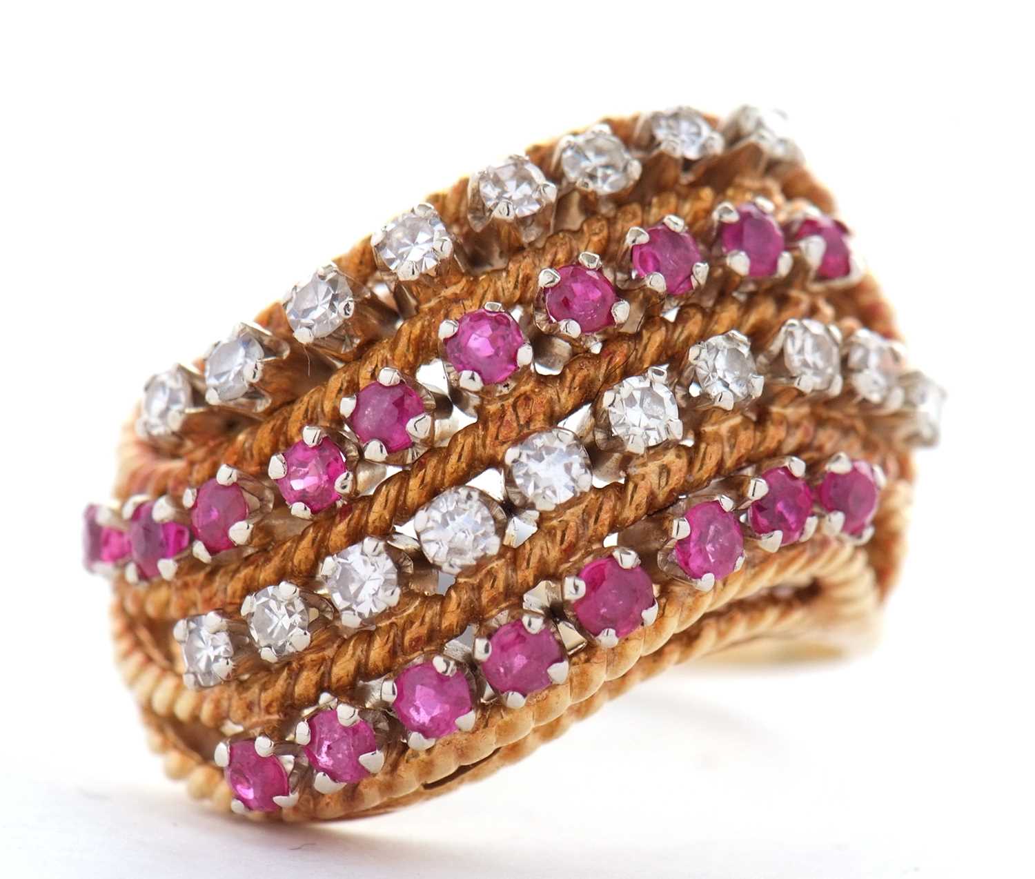 An 18ct diamond and ruby ring, set with four alternating curving diagonal rows of rubies and - Image 2 of 10