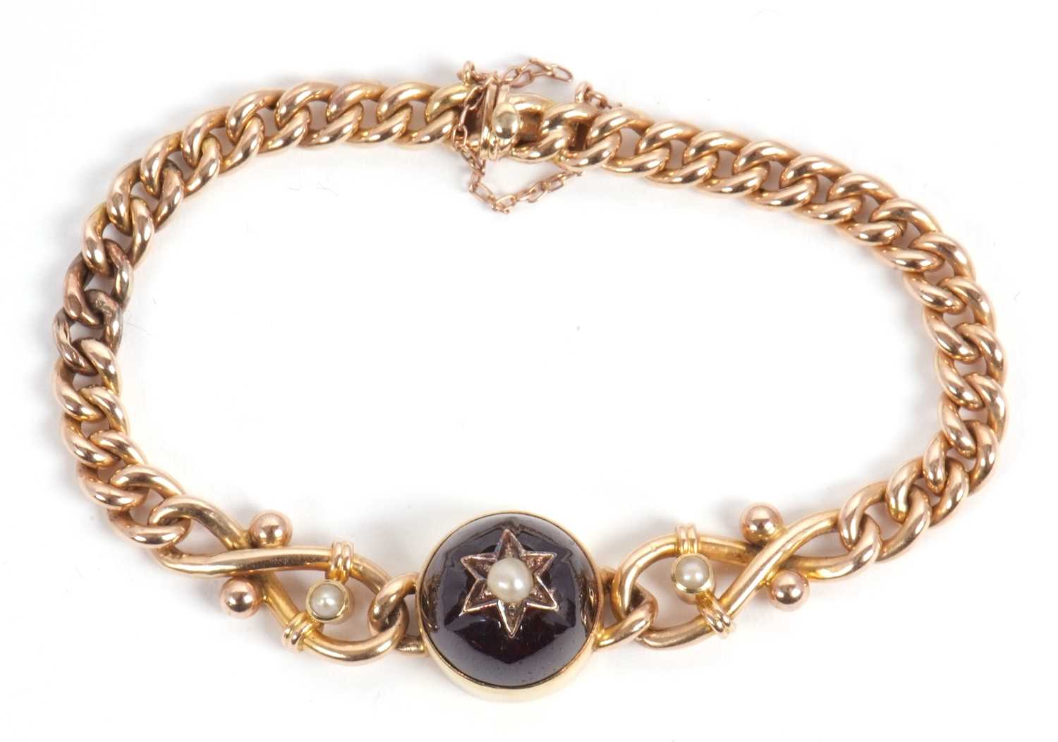 A late 19th century 15ct garnet bracelet, set to centre with a round garnet cabochon with a split - Image 2 of 6