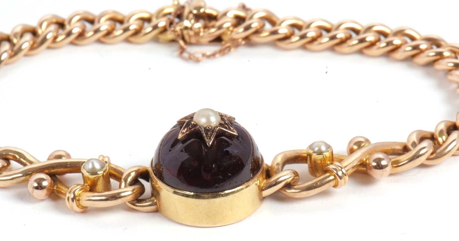 A late 19th century 15ct garnet bracelet, set to centre with a round garnet cabochon with a split - Image 3 of 6