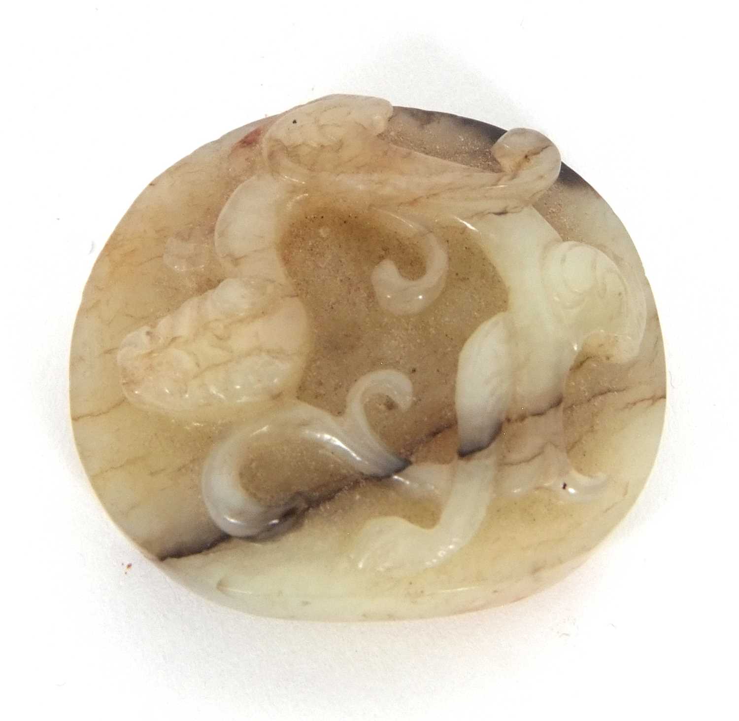 A jade pendant with dragon carving with brown occlusions, 4cm diameter - Image 4 of 6