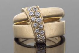 An Asprey 18ct and diamond ring, the double band set with a horizontal sweep of pave set diamonds,