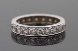 A diamond eternity ring, set throughouyt with round brilliant cut diamonds, total estimated