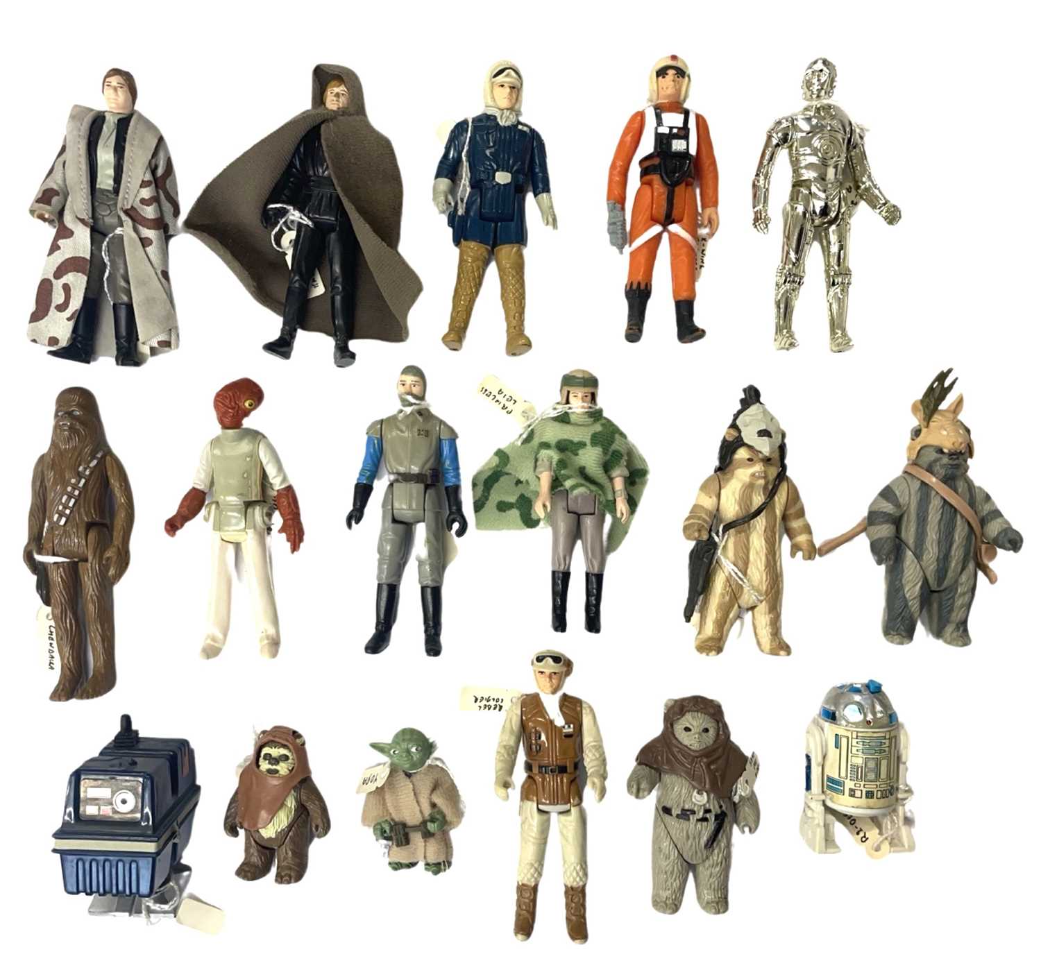 A collection of vintage Star Wars action figures, all marked LFL, to include: - C-3PO - R2-D2 - Yoda