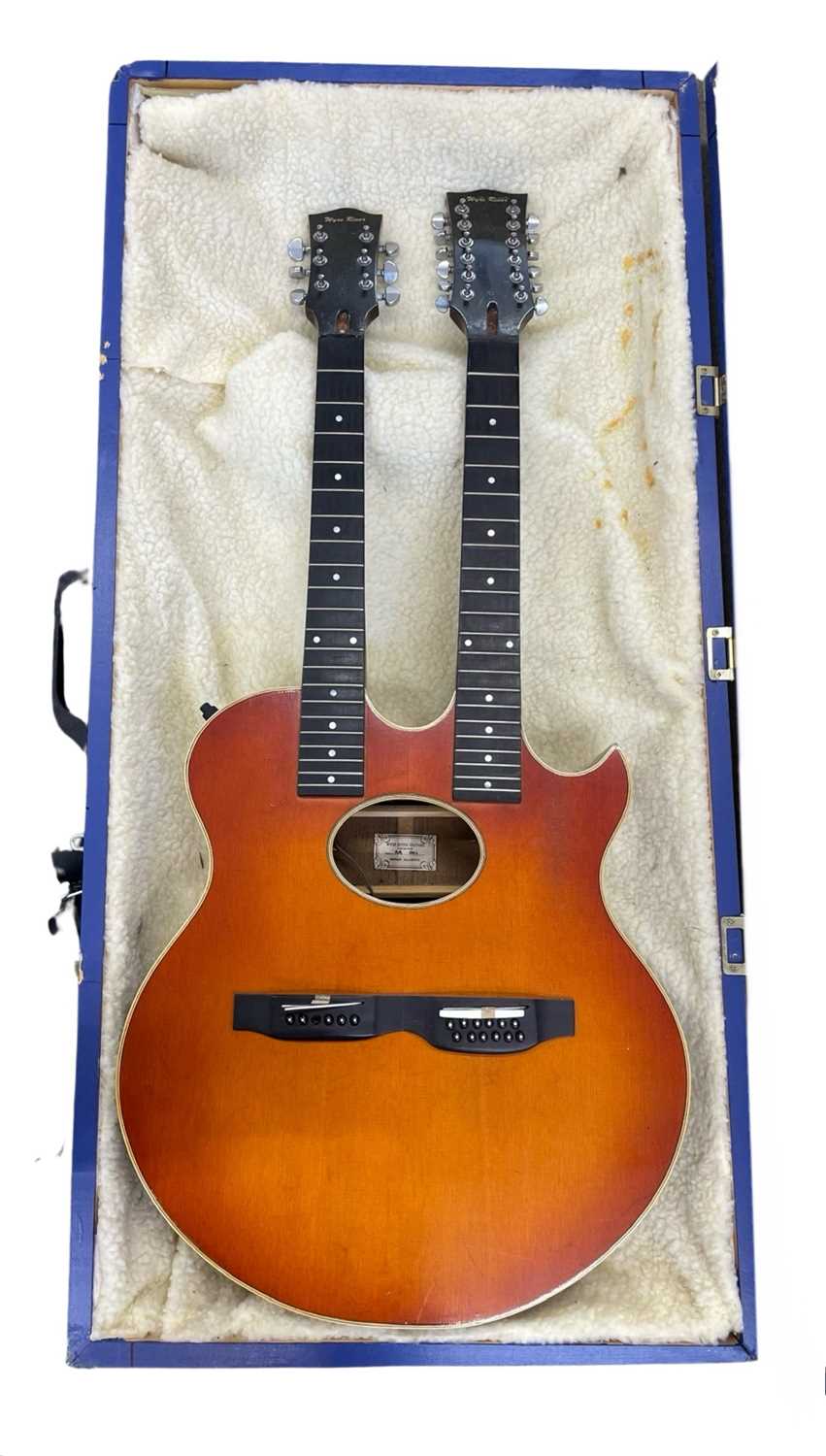 A custom made Wyre River double-necked semi-acoustic guitar body, in need of TLC and repair. With