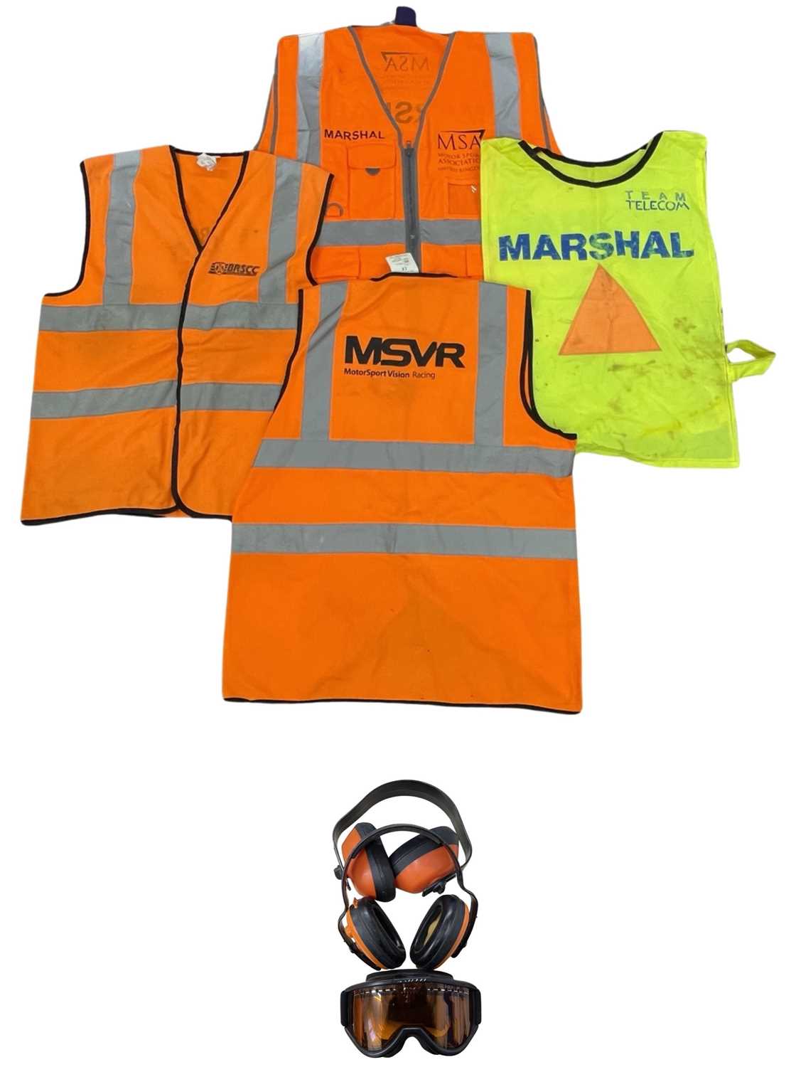 A collection of various worn Motor Racing Marshall hi-viz vests, together with 2 paris of ear