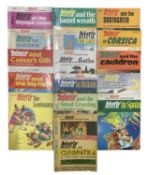 A collection of various 1970s Asterix comic books