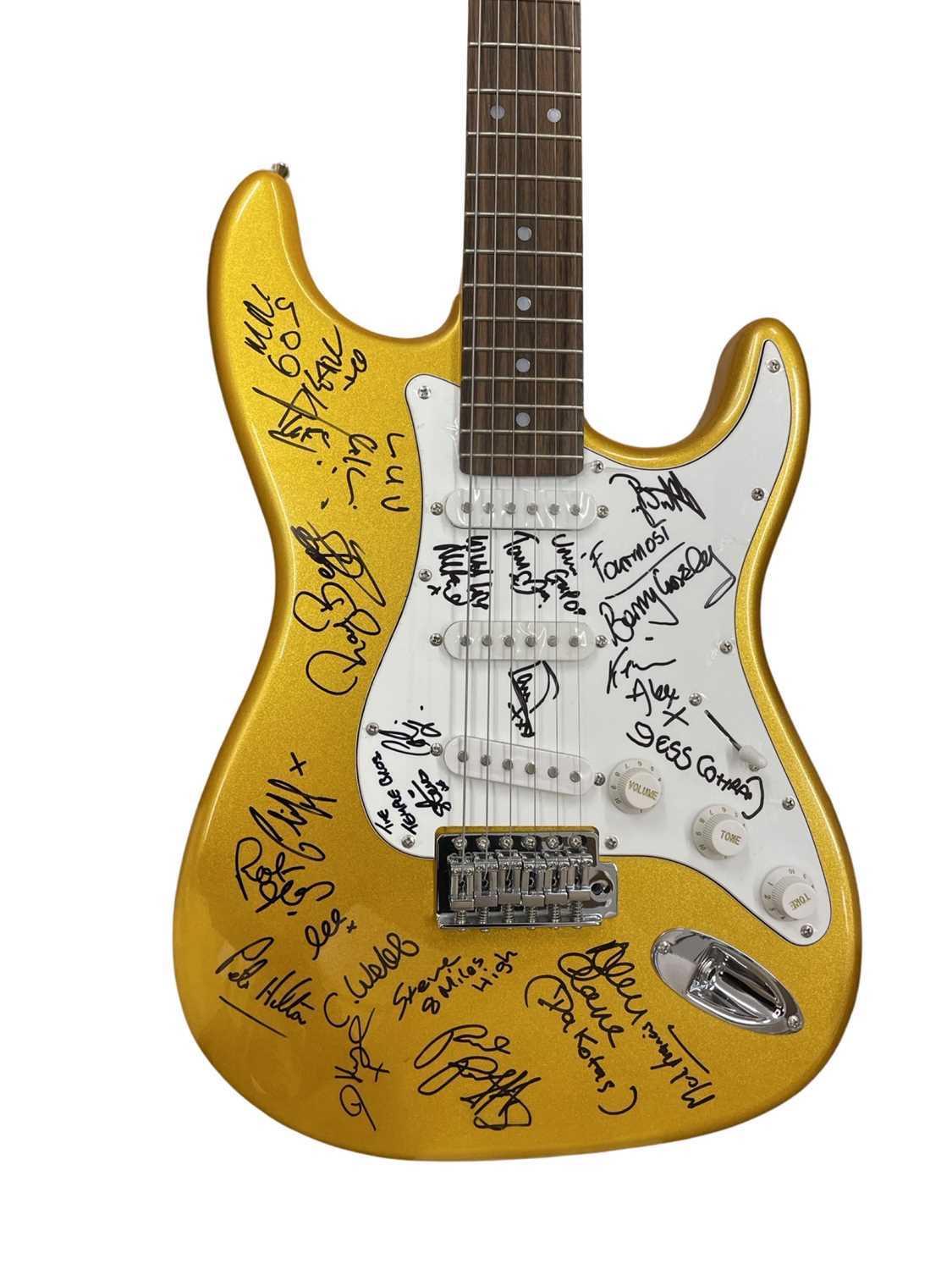 An Aria electric guitar, bearing the signatures of various 1960s bands in black ink, to include: - - Image 3 of 5