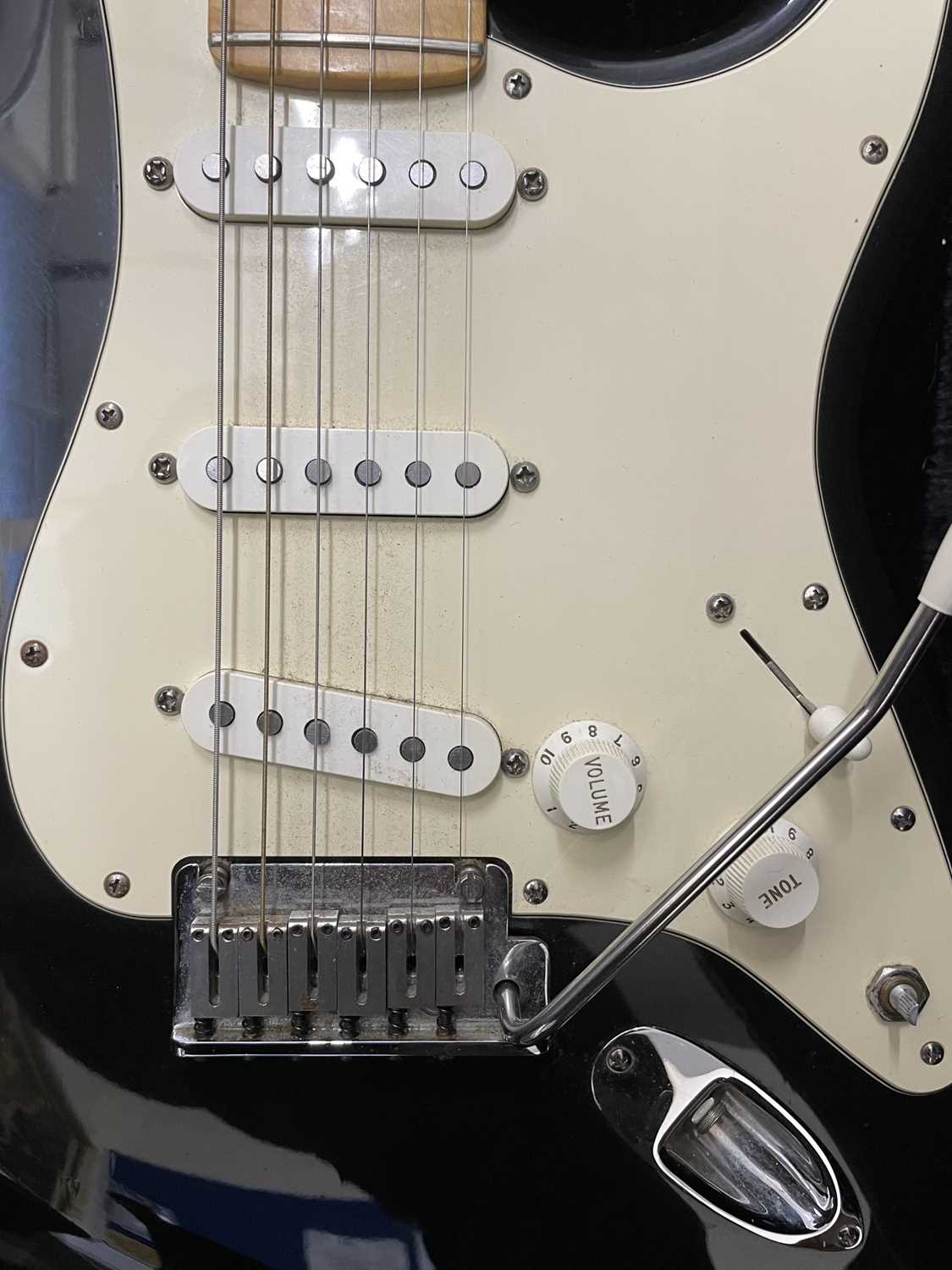 An American Fender Stratocaster electric guitar, circa 2001 in black, with black hardcase and - Image 5 of 5