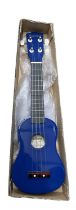 A boxed Falcon ukulele in blue