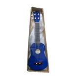 A boxed Falcon ukulele in blue