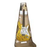 An Aria electric guitar, bearing the signatures of various 1960s bands in black ink, to include: -