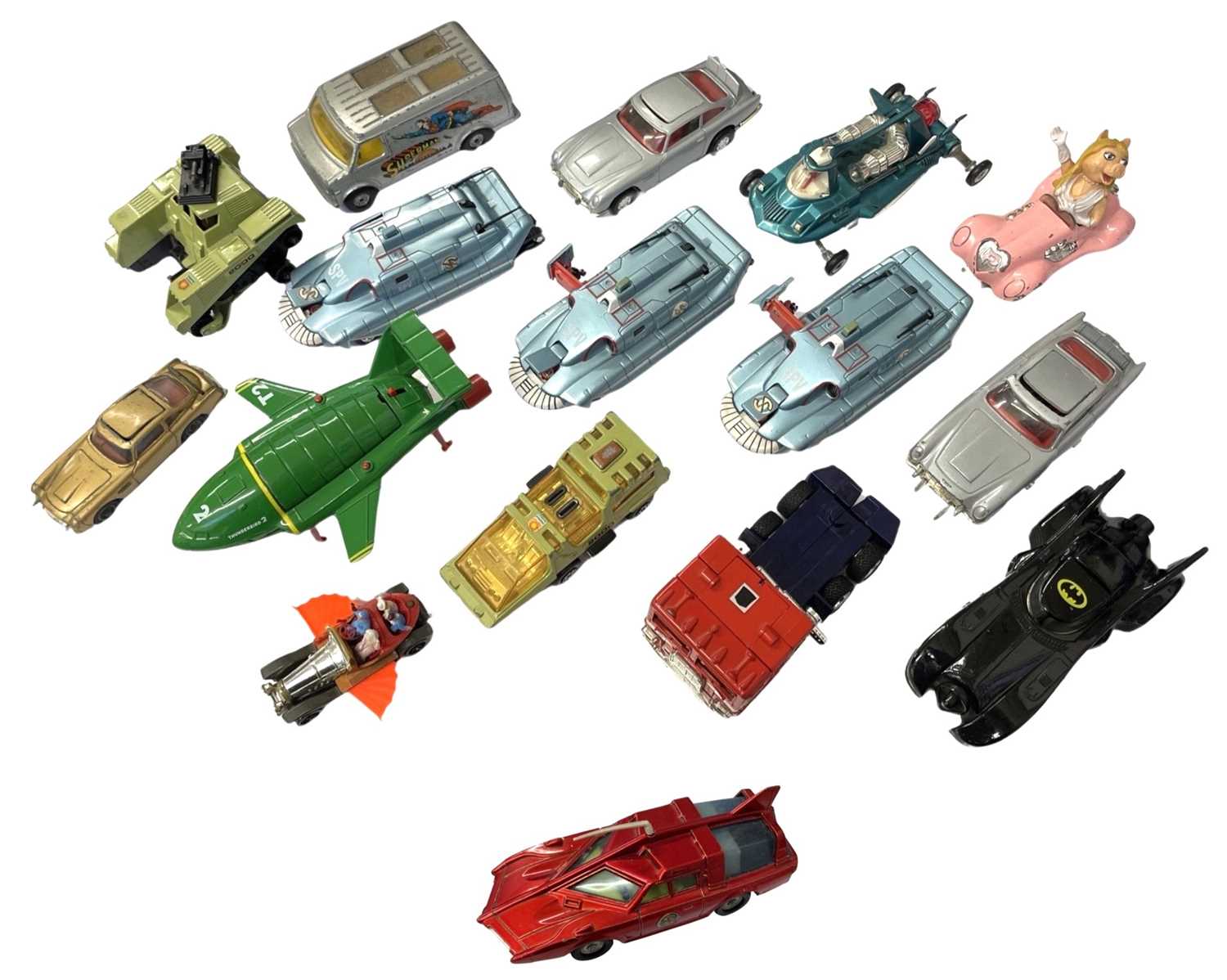 A collection of various die-cast TV toy vehicles, to include the Batmobile, Chitty Chitty Bang Bang,