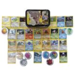 A Mewtwo Pokemon collector's tin, containing a quantity of early 2000s Pokemon cards, handmade