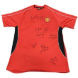 An official Manchester United shirt, bearing the signatures of: - Ryan Giggs - Wayne Rooney - Paul