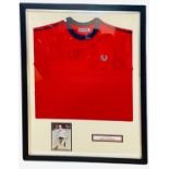 A framed Fred Perry t-shirt and photograph, bearing the signature of tennis player, Andy Murray.