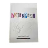 A theatre programme for Hairspray at the Norwich Theatre Royal, bearing the signatures of several