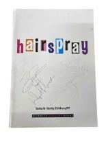 A theatre programme for Hairspray at the Norwich Theatre Royal, bearing the signatures of several