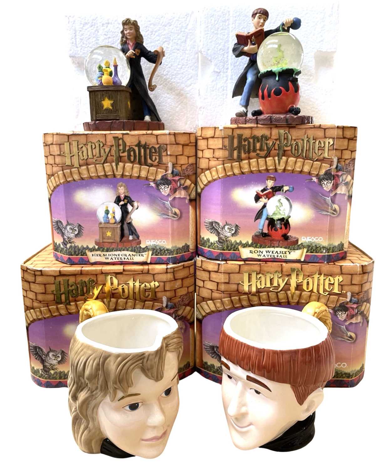 A mixed lot of Enesco Harry Potter collectables, to include Hermione Granger and Ron Weasley mugs
