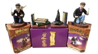 A collection of various boxed Harry Potter book-ends by Enesco