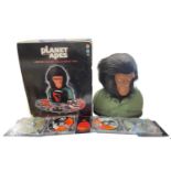 A boxed Planet of the Apes collector's set, with 14 DVD discs, housed within a model ape bust.