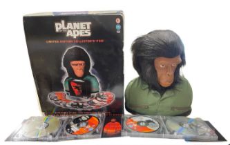 A boxed Planet of the Apes collector's set, with 14 DVD discs, housed within a model ape bust.