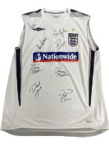 An England football tank top, bearing the signatures of: - David Beckham - Rio Ferdinand - David